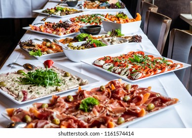 Party Brunch big Buffet table setting with Food Meat Vegetables - Powered by Shutterstock