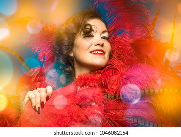 Party Burlesque Brunette Dancer Woman, Goes Naked With A Big Game Of Red Feathers And Show And Party Makeup