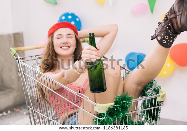Party Celebration of a beautiful young\
attractive multi-ethnic, expression, beautiful, smiling, laughing\
and relaxing on a white background. Adorned with colorful flags And\
a car for shopping