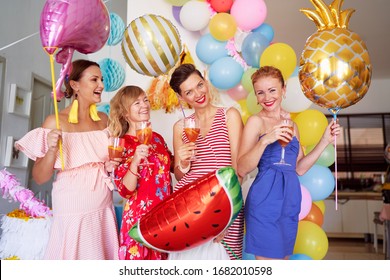 Party And Celebration. Group Of Happy Smiling Young Women Drinking Cocktails Having Fun Together At Home Decorated With Air Baloons.