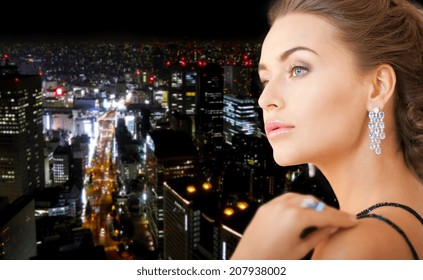 Party, Celebration, Holiday And People Concept - Beautiful Woman In Evening Dress Wearing Diamond Earrings