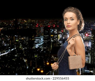 Party, Celebration, Holiday And People Concept - Beautiful Woman In Evening Dress With Small Bag