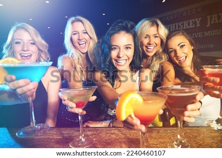 Party, cocktails and women friends cheers for celebration of birthday, new years or happy hour at a nightclub or event with alcohol. Female group celebrate with drinks for ladies night at a club