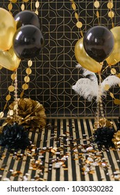 Party Decor. Golden Decoration On Black Background With Ballons