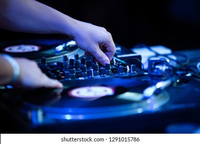 Party Dj Boy Plays Music On Stage With Retro Vinyl Turntables And Sound Mixer.Professional Disc Jockey In The Club Mixes Musical Tracks With Vintage Audio Equipment.Hip Hop Djs Hands On Decks