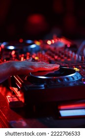 Party Dj Playing Music In Night Club With Professional Cd Turntables. Disc Jockey Mixing Musical Tracks On Concert Stage. Download Stock Photo Of Disk Jokey Turn Table On Stage In Nightclub