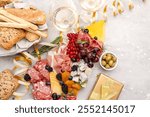 Party food charcuterie board  prosciutto ham, salami and cheese appetizers served in the shape of a Christmas tree. party food for aperitif,  New Year