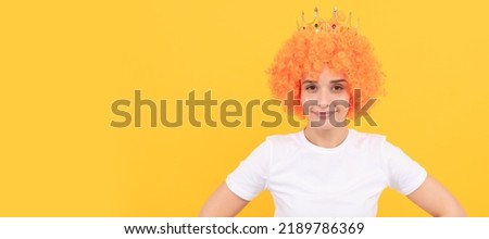 Party fun wig. cheeful freaky selfish woman in curly clown wig and queen crown for party, joy. Woman isolated face portrait, banner with copy space.