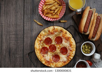 Party Game Day Food Homemade Pizza Hot Dogs Fries Juice And Dips - Super Bowl Food Concept Overhead View