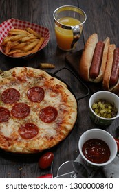 Party Game Day Food Homemade Pizza Hot Dogs Fries Juice And Dips - Super Bowl Food Concept Overhead View