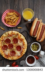 Party Game Day Food Homemade Pizza Hot Dogs Fries Juice And Dips - Super Bowl Food Concept Overhead View