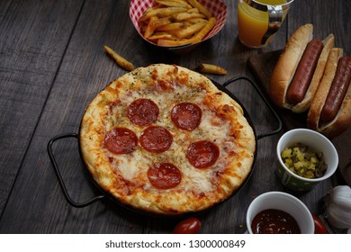 Party Game Day Food Homemade Pizza Hot Dogs Fries Juice And Dips - Super Bowl Food Concept Overhead View