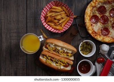 Party Game Day Food Homemade Pizza Hot Dogs Fries Juice And Dips - Super Bowl Food Concept Overhead View