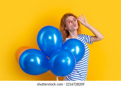 party girl with balloon in sunglasses. happy girl hold party balloons in studio. girl with balloon