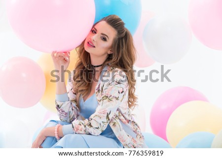Party girl, balloons, having fun. Birthday party. Happy woman.
