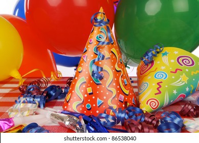 A Party Hat And Favors On The Table