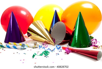 Party Hats, Noise Makers, Streamers, Balloons And Confetti On A White Background