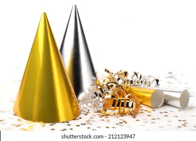 Party hats,paper streamer and confetti on white background