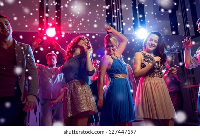 Party, Holidays, Celebration, Nightlife And People Concept - Smiling Friends Dancing In Club