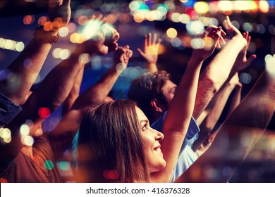 party, holidays, celebration, nightlife and people concept - smiling friends waving hands at concert in club - Shutterstock ID 416376328