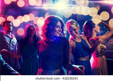 party, holidays, celebration, nightlife and people concept - smiling friends dancing in club - Shutterstock ID 418230241