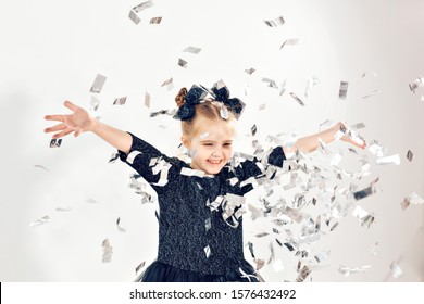 Party, Holidays, New Year And Celebration Concept - Female Child Throwing Confetti.