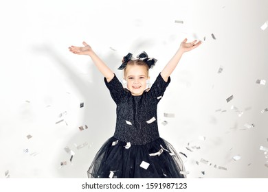 Party, Holidays, New Year And Celebration Concept - Female Child Throwing Confetti.