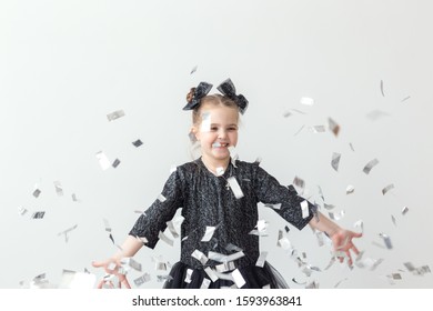 Party, Holidays, New Year And Celebration Concept - Female Child Throwing Confetti.