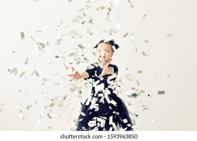 Party, Holidays, New Year And Celebration Concept - Female Child Throwing Confetti.