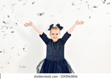 Party, Holidays, New Year And Celebration Concept - Female Child Throwing Confetti.