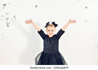 Party, Holidays, New Year And Celebration Concept - Female Child Throwing Confetti.