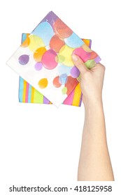 Party Napkins In A Hand Isolated On White Background. Party And Celebration Supplies