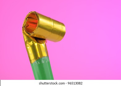 Party Noise Maker On Pink Background