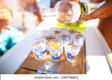 Party on the beach, refill glass with alcoholic beverage, drinking shots with friends, enjoying freedom, happy carefree summer vacation
 - Powered by Shutterstock