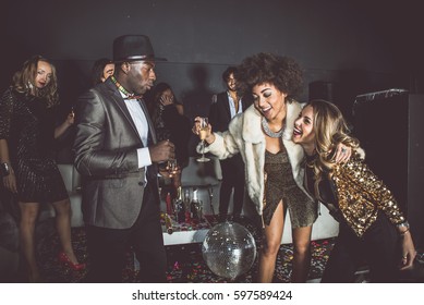 Party people celebrating in the club - Shutterstock ID 597589424