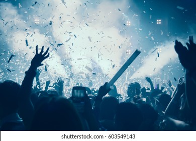  Party People Concept. Crowd Happy And Joyful In Rock Concert Music Festival. Celebration Party Festival. Blurry Night Club. DJ Show Concert Playing  Music EDM On Stage .