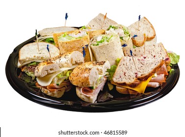 A Party Platter With Wraps, Bagels And Sandwiches Isolated On A White Background.