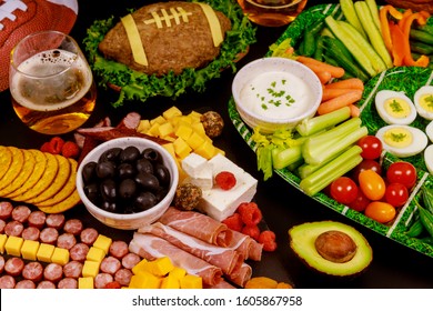 Party Table With Food And Drink For Watching American Football Game.