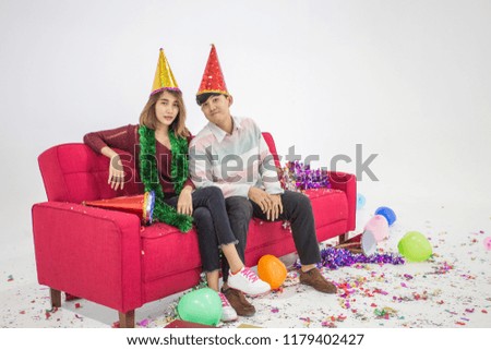 Similar – Young couple celebrating a party with their dog