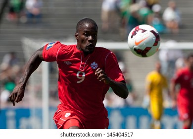 PASADENA, CA - JULY 7: Tosaint Ricketts #9 Of Canada Chases Down The Ball During The 2013 CONCACAF Gold Cup Game Between Canada And Martinique On July 7, 2013 At The Rose Bowl In Pasadena, Ca.