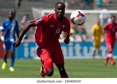 PASADENA, CA - JULY 7: Tosaint Ricketts #9 Of Canada Chases Down The Ball During The 2013 CONCACAF Gold Cup Game Between Canada And Martinique On July 7, 2013 At The Rose Bowl In Pasadena, Ca.