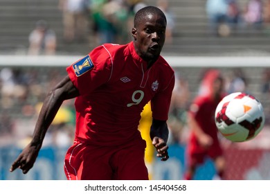 PASADENA, CA - JULY 7: Tosaint Ricketts #9 Of Canada Chases Down The Ball During The 2013 CONCACAF Gold Cup Game Between Canada And Martinique On July 7, 2013 At The Rose Bowl In Pasadena, Ca.