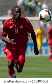 PASADENA, CA - JULY 7: Tosaint Ricketts #9 Of Canada Chases Down The Ball During The 2013 CONCACAF Gold Cup Game Between Canada And Martinique On July 7, 2013 At The Rose Bowl In Pasadena, Ca.