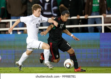 PASADENA, CA. - March 3:  Michael McGlinchey (L) And Giovani Dos Santos (R) During The New Zealand Vs. Mexico Friendly On March 3 2010 At The Rose Bowl In Pasadena.