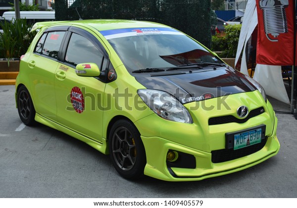 PASAY, PH - MAY 26: Lime\
green Toyota Yaris at Toyota car fest on May 26, 2019 in Pasay,\
Philippines.