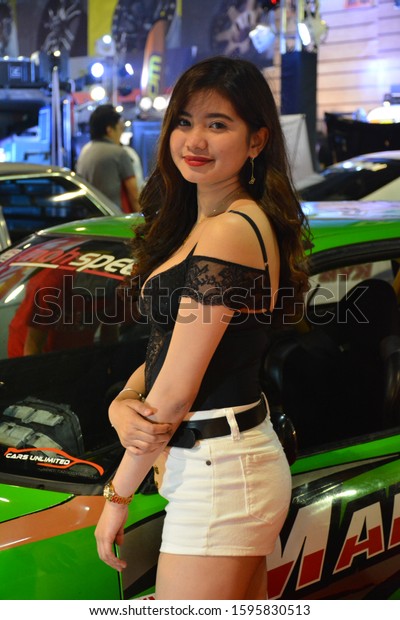 PASAY, PH - NOV. 16: Car Show female model at Manila\
Auto Salon on November 16, 2019 in SMX Convention Center, Pasay,\
Philippines.  