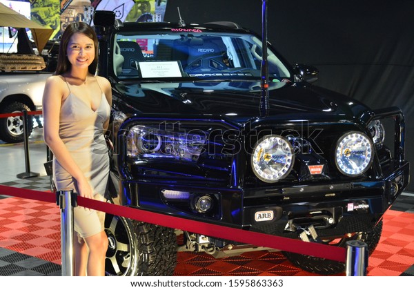 PASAY, PH - NOV. 16: Car show female model at Manila\
Auto Salon on November 16, 2019 in SMX Convention Center, Pasay,\
Philippines.  