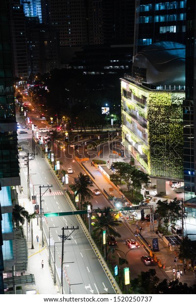 Pasig City, Ortigas / Philippines - September 7, 2019:\
intersection of Julia Vargas and ADB Avenue of Ortigas Center\
during nighttime 