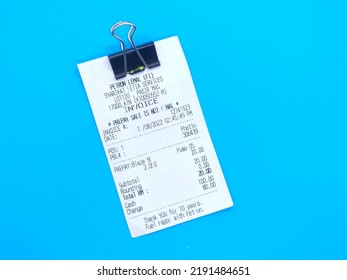 Pasir Mas, Malaysia:19, August, 2022-Paper Clip And Receipt Blue Background.  Objects Are Used In Business Transactions.