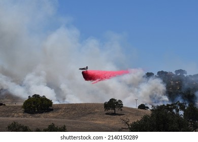 Paso Robles, California, USA - Circa July 2020: Fire Fighting Aircraft Over A Wildfire On Acreage Near Paso Robles, California